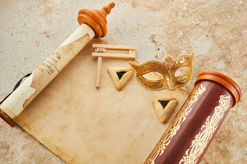 Scroll of Esther, haman's ears cookies and Purim Festival objects.