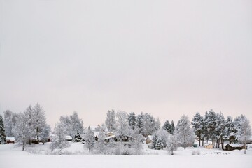 Beautiful winter scenery around Boden lake, around Arctic Circle. Frozen trees and snowy buildings...