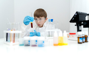 a student conducts experiments in a chemical laboratory