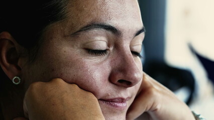 Obraz premium One tearful woman face lost in thought. Sad pensive emotion of a person staring at horizon with thougtful expression suffering from depression