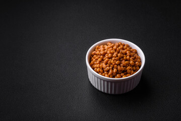 Delicious healthy canned lentils in a ceramic ribbed white bowl