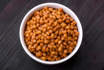 Delicious healthy canned lentils in a ceramic ribbed white bowl
