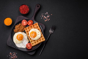 Delicious hearty breakfast consisting of a fried egg, Belgian waffle