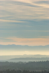 Stunning colors over the south of Vancouver Island as the sun sets through a hazy sky.