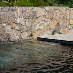 stone steps into a swimming pool