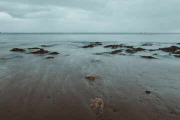 gentle waves washing back out to sea