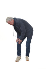 full length portrait of a man in knee pain in isolated on white