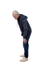 Naklejka premium portrait of a side view of a man crouched down and looking the floor on white background