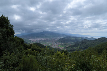 Beautiful green landscape with mountain and clouds. 