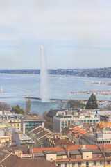 Panoramic view of city of Geneva, Lake Geneva and Jet d'Eau fountain in Switzerland. View from the bell tower of Saint Pierre Cathedral