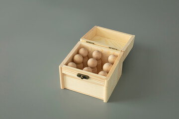 Unity concept. Wood open box with wooden figures represent people.