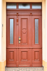 View of old building with wooden door