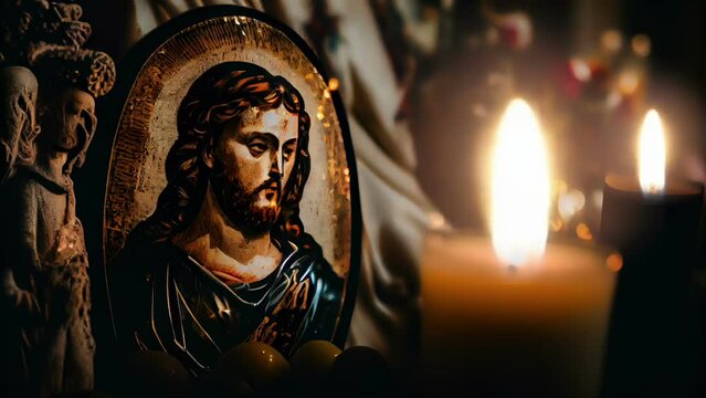 Cinemagraph of The image of Christ on the decoration beside the lighted candle