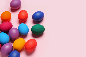 Colorful Easter eggs on pink background