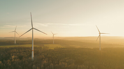 Aerial view of wind turbines in the evening sunlight 