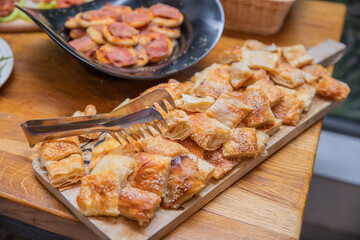 A beautifully prepared buffet of delicious snacks, dishes and desserts celebrating a special event with elegance.