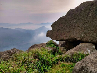 View of nature, rocks and mountains in Tai Mo Shan Country Park. Fog over the peaks of the mountains. Hong Kong. China. Asia	