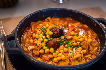 chickpea stew with chorizo and blood sausage, typical Spanish dish