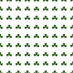 Fototapeta premium Shamrock or green clover leaves seamless pattern background flat design vector illustration 