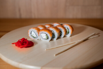 Beautifully laid out sushi on a wooden stand