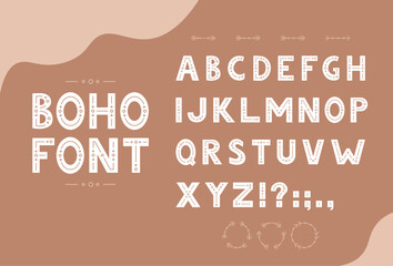 Cute hand drawn boho font with latin alphabet and decorative elements.