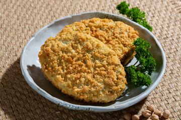 Uncooked fresh vegan and vegetarian burgers made from fresh vegetables and dried legumes and beans, ready to barbecue grill