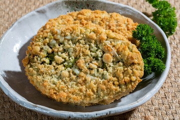 Uncooked fresh vegan and vegetarian burgers made from fresh vegetables and dried legumes and beans, ready to barbecue grill