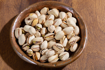 Roasted salty pistachio nuts, tasty healthy vegetarian food