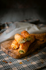 Bakery shop products - various kinds of baguette, bagel, donut, croissant, rolls, bread, puff pastry, powdered sugar delicious pies. Neutral background. Food from bakeries.