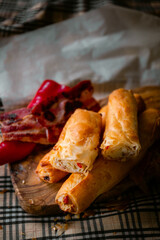 Bakery shop products - various kinds of baguette, bagel, donut, croissant, rolls, bread, puff pastry, powdered sugar delicious pies. Neutral background. Food from bakeries.