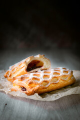Bakery shop products - various kinds of baguette, bagel, donut, croissant, rolls, bread, puff pastry, powdered sugar delicious pies. Neutral background. Food from bakeries.