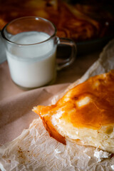Bakery shop products - various kinds of baguette, bagel, donut, croissant, rolls, bread, puff pastry, powdered sugar delicious pies. Neutral background. Food from bakeries.
