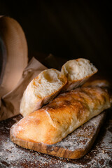 Bakery shop products - various kinds of baguette, bagel, donut, croissant, rolls, bread, puff pastry, powdered sugar delicious pies. Neutral background. Food from bakeries.