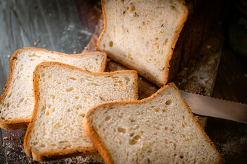 Bakery shop products - various kinds of baguette, bagel, donut, croissant, rolls, bread, puff pastry, powdered sugar delicious pies. Neutral background. Food from bakeries.