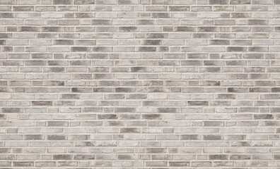 Rustic brick wall, sunlit background. Light painted stone texture for design templates or web backdrop.