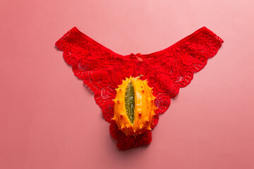 Exotic fruit in the form of a vagina on women's panties, the concept of the female reproductive system