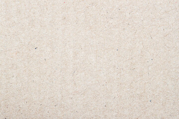 Natural paper texture cardboard background with small inclusions of cellulose