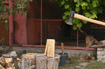 The axe moves towards the log.
