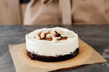 A beautiful, freshly made small cake with nuts and caramel. Close up.