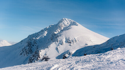 Fototapeta na wymiar panoramic mountain landscape with a lot of snow in winter. Mountain in Asturias, Spain- ski slope