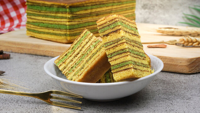 Spekkoek (kue lapis legit or spekuk in Indonesian). it served on white plate