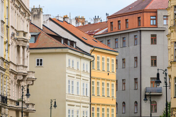 Fototapeta premium Facade of the house of classical European architecture of the old cozy tourist city. Background