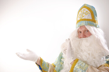different positive emotions of St. Nicholas the Wonderworker who was the founder of Santa Claus turquoise suit with gold with a traditional religious cap like a priest has a cassock and a belt