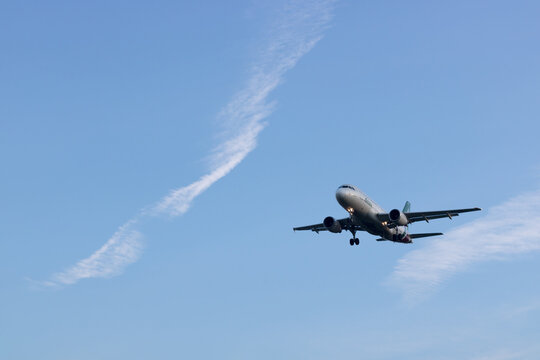 LINATE AIRPORT, ITALY - CIRCA JANUARY 2023: commercial flights landing at Milan's city airport in the late afternoon