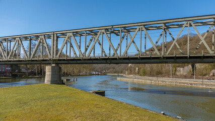 Fototapeta na wymiar Railway bridge over the Meuse river, in Dinant, Belgium