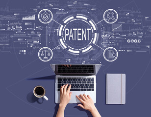 Obraz na płótnie Canvas Patent concept with person using a laptop computer