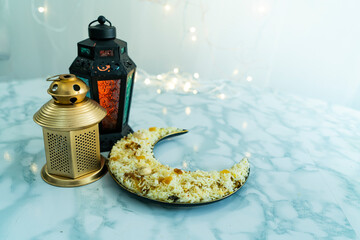 Turkish lantern lights and arabic rice, Ramadan and Eid concept Selective focus