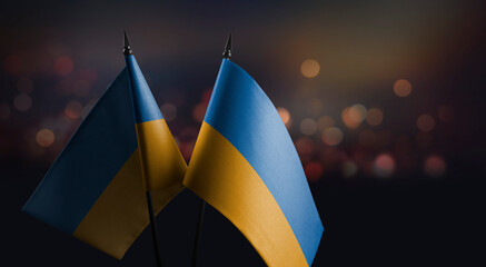 A small Ukraine flag on an abstract blurry background