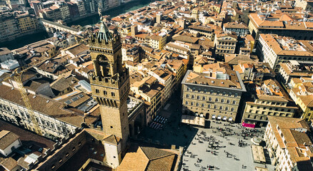 Aerial view of famous tower and Palazzo Vecchio square and Florence cityscape, Italy. High quality photo