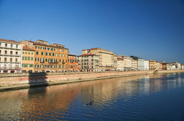 Fototapeta na wymiar Cityscape with Pisa old town and Arno river in Tuscany, Italy. High quality photo